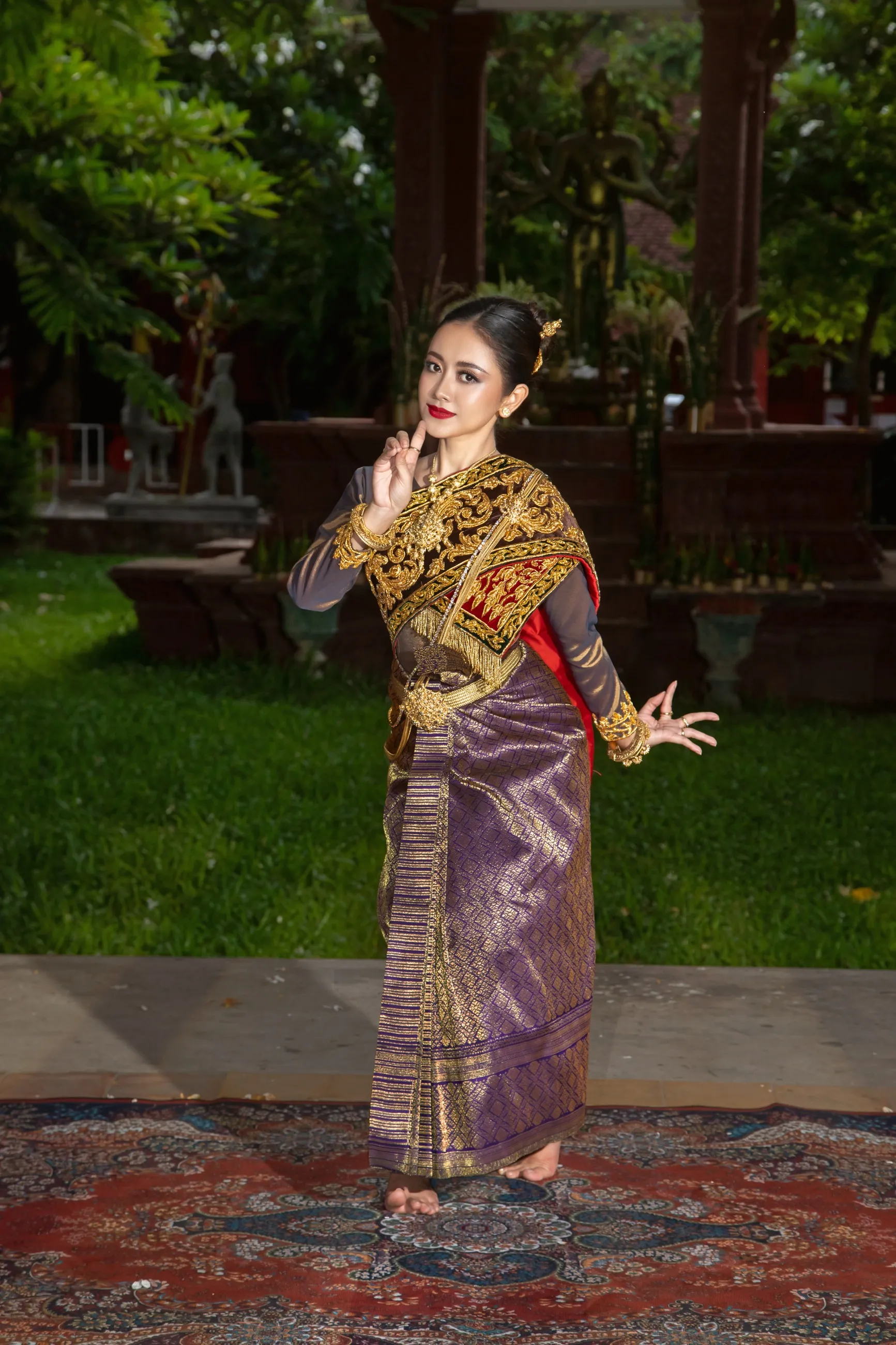 Serei Van Kosaun in classical costume in a temple garden